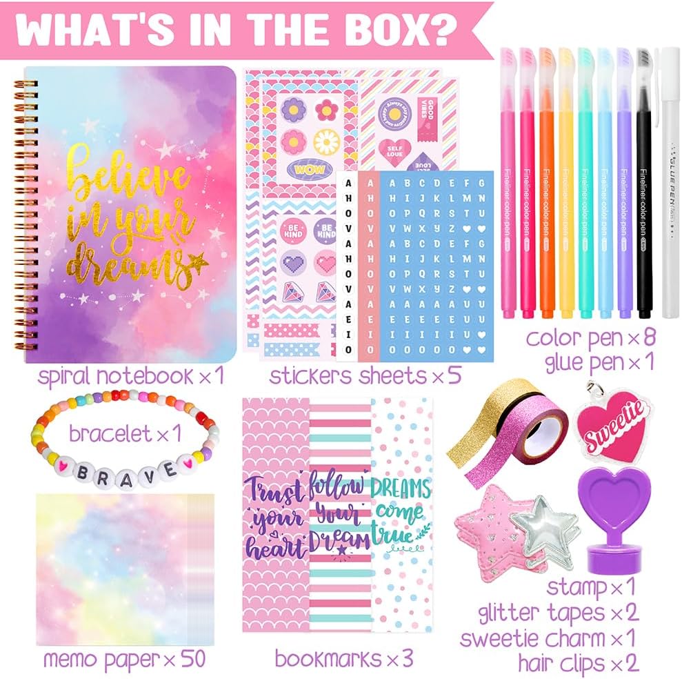 Collection of stationery items including a notebook, stickers, pens, and decorative elements on a pink background.